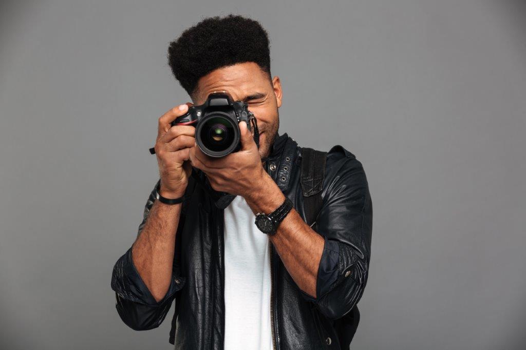 A photographer preparing for a family photoshoot